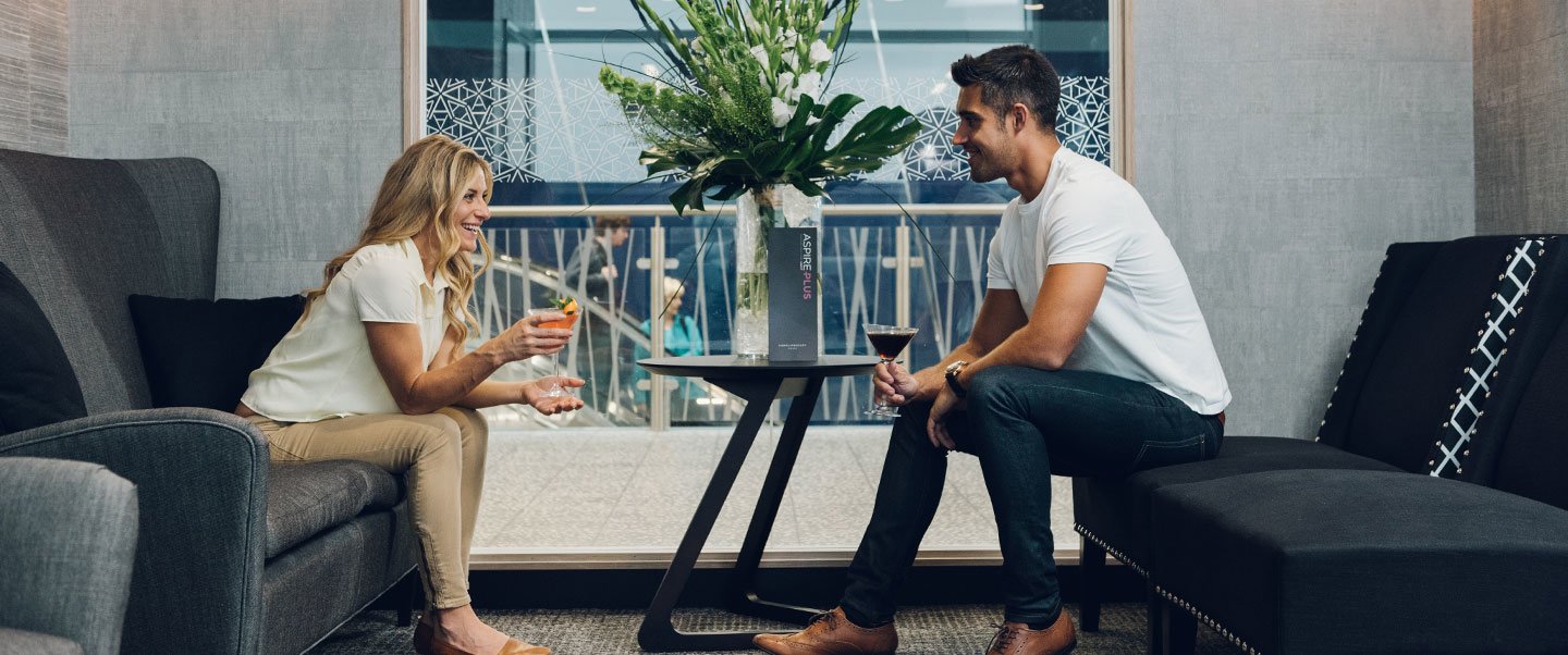 Couple sat in the Bristol Airport AspirePlus Lounge