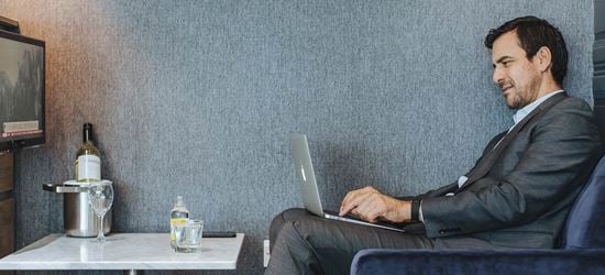 A Passenger in the Club Aspire Airport Lounge at London Heathrow Airport Terminal 3