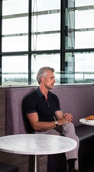 Passengers in the Aspire Airport Lounge at London Heathrow Airport Terminal 5