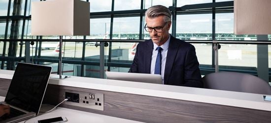 A Passenger Working in the Aspire Airport Lounge in London Heathrow Airport Terminal 5