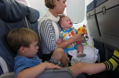 Woman with two children on flight