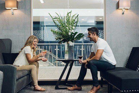 Woman and man enjoying cocktail together