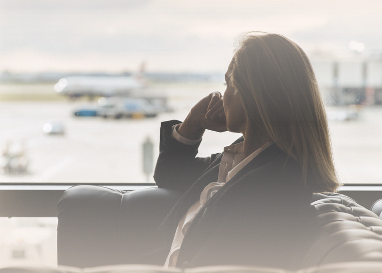 Woman sat in lounge because of flight delay