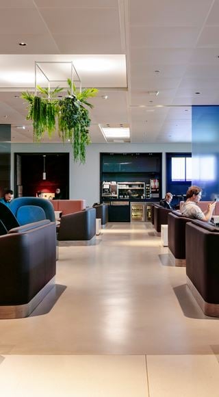 Guests Enjoying The Amsterdam Schiphol Airport Lounge