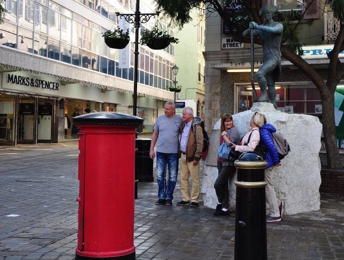 A group of people gathered outside M&S in Gibraltar